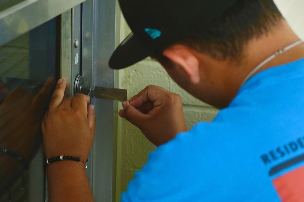 Certified locksmith installing a residential deadbolt in Tucson, AZ